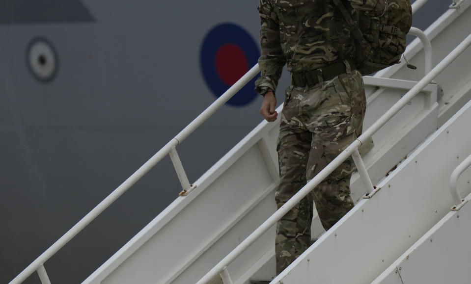 A member of the British armed forces 16 Air Assault Brigade disembarks a RAF Voyager aircraft after landing at Brize Norton, England, as they return from helping in operations to evacuate people from Kabul airport in Afghanistan, Saturday, Aug. 28, 2021. More than 100,000 people have been safely evacuated through the Kabul airport, according to the U.S., but thousands more are struggling to leave in one of history's biggest airlifts. (AP Photo/Alastair Grant, Pool)