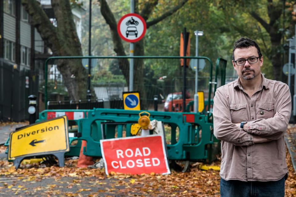 Across the barricades: the Reverend Paul Yeulett of Grove Chapel in Camberwell Grove. Residents on one side of the bridge want it to reopen so they can drive across but some on the other side want it to stay shut