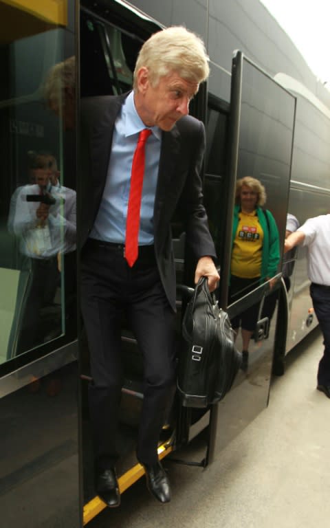 Arsenal's French manager Arsene Wenger steps from the coach in Watford, north of London on August 27, 2016