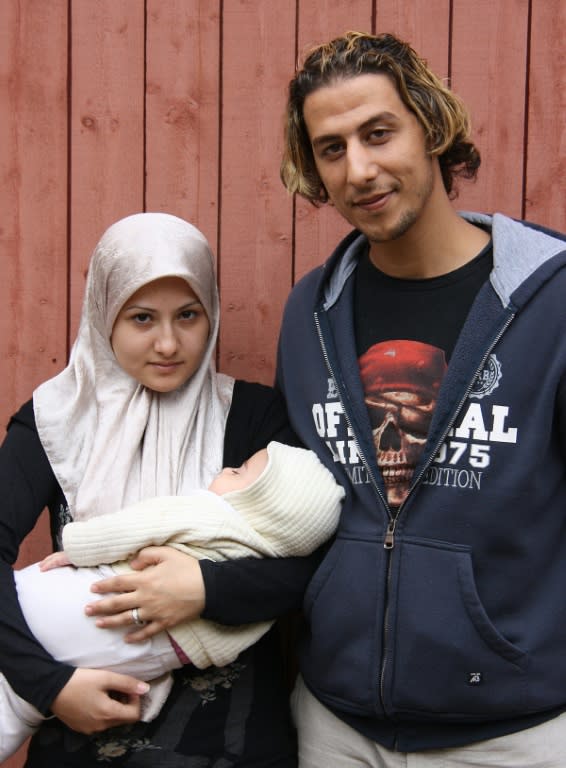 Syrian refugees Walaa Al Hodl,(L), and Kahled Al Hodl applied for asylum in Sweden with their six-month-old girl Nour in 2013