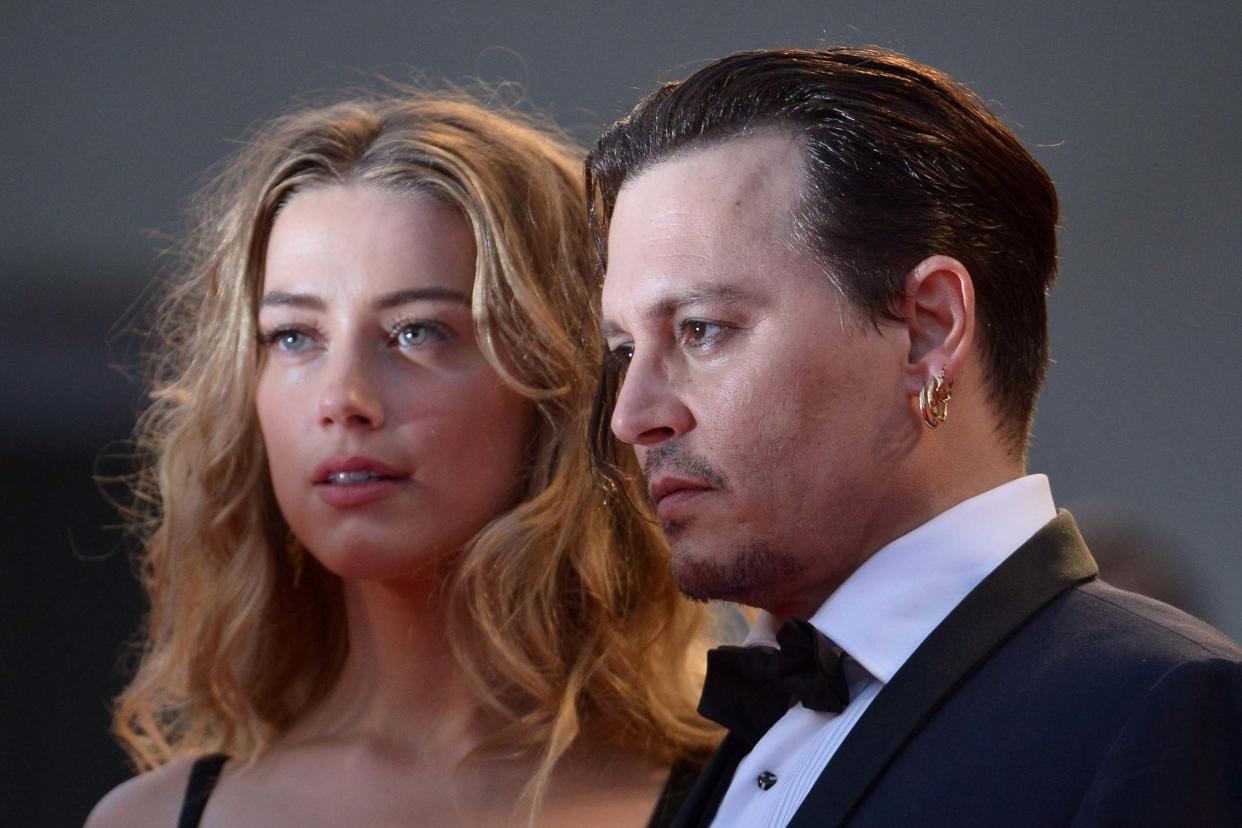 The legals have landed: Johnny Depp and Amber Heard in 2015: AFP via Getty Images