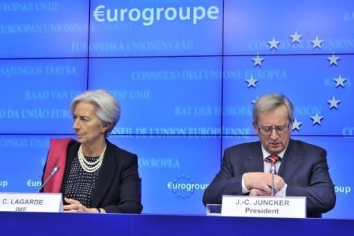 International Monetary Fund Managing Director Christine Lagarde and Luxembourg Prime Minister and Eurogroup president Jean-Claude Juncker give a press conference at the EU headquarters in Brussels. A huge eurozone rescue package agreed saves Greece from default, keeps it in the single currency bloc under strict controls but markets are sceptical and Greek unions are calling fresh protests