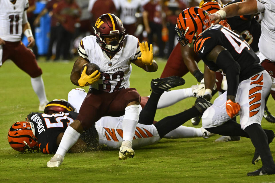 Washington Commanders running back Jaret Patterson (32) carries the ball against the Cincinnati Bengals during the second half at FedExField. Mandatory Credit: Brad Mills-USA TODAY Sports