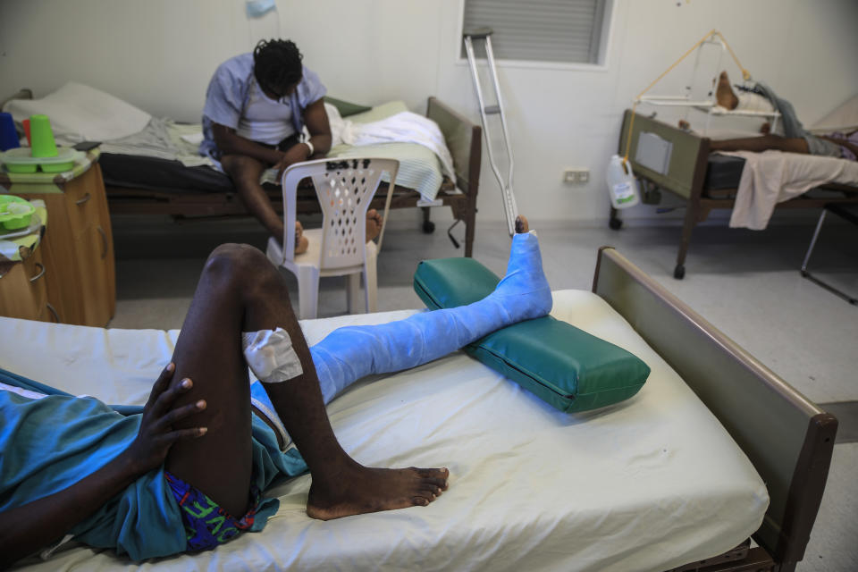 Gladimy Trismer-Saint, who was shot in his left foot by a stray bullet, lies on a bed at a clinic run by Doctors Without Borders in the Tabarre neighborhood of Port-au-Prince, Haiti, Wednesday, Jan. 25, 2023. “Gang-related violence has reached levels not seen in years … touching near all segments of society,” said Helen La Lime, U.N. special envoy for Haiti, in a late January Security Council meeting. (AP Photo/Odelyn Joseph)