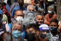 People gather outside of the Our Lady of La Candelaria church in Caracas