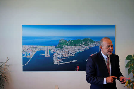 Gibraltar's financial services and gaming Minister Albert Isola talks to a journalist as he poses for a photo during an interview with Reuters in the British overseas territory of Gibraltar, historically claimed by Spain, September 14, 2016. REUTERS/Jon Nazca