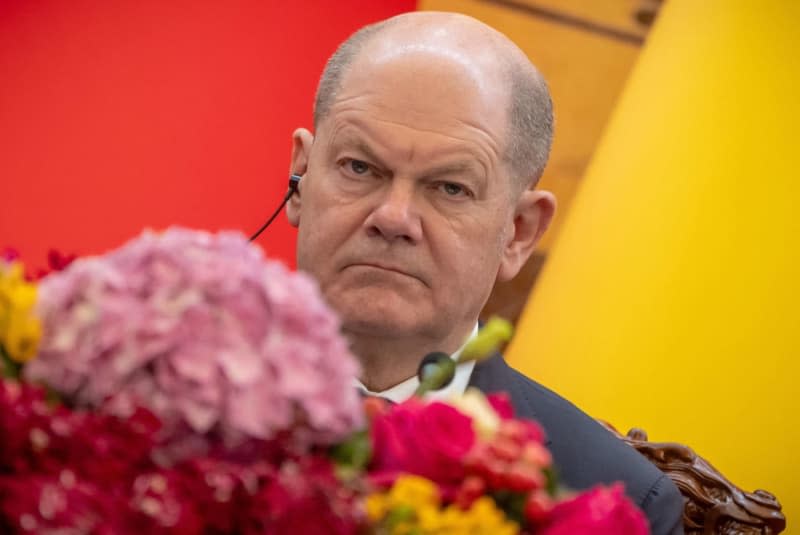 German Chancellor Olaf Scholz takes part in a press meeting after the talks in the Great Hall of the People. Michael Kappeler/dpa