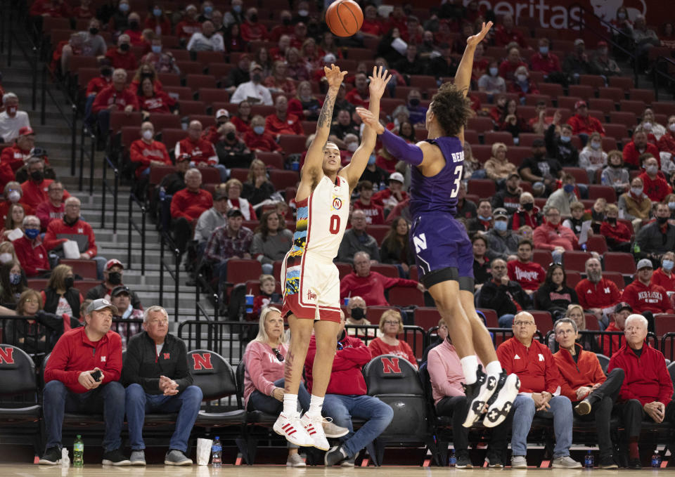 FILE - Nebraska's C.J. Wilcher (0) shoots a 3-pointer over Northwestern's Ty Berry (3) during the first half of an NCAA college basketball game Saturday, Feb. 5, 2022, in Lincoln, Neb. Wilcher the top returning 3-point shooter. (AP Photo/Rebecca S. Gratz, File)