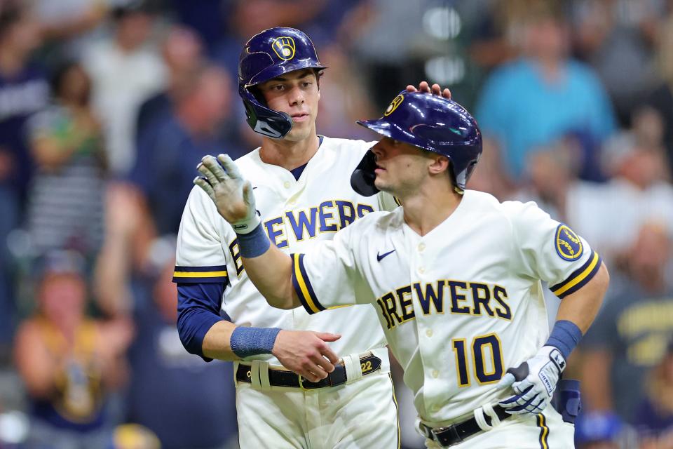 Sal Frelick is congratulated by Brewers teammate Christian Yelich after hitting a three-run homer in the eight inning Monday night.