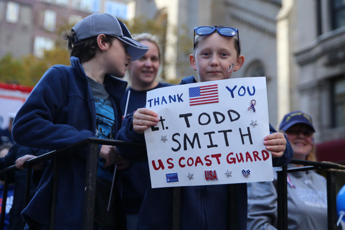 <p>A child on a float holds a sign honoring a Coast Guard member during the Veterans Day parade in New York City on Nov. 11, 2016. (Gordon Donovan/Yahoo News) </p>