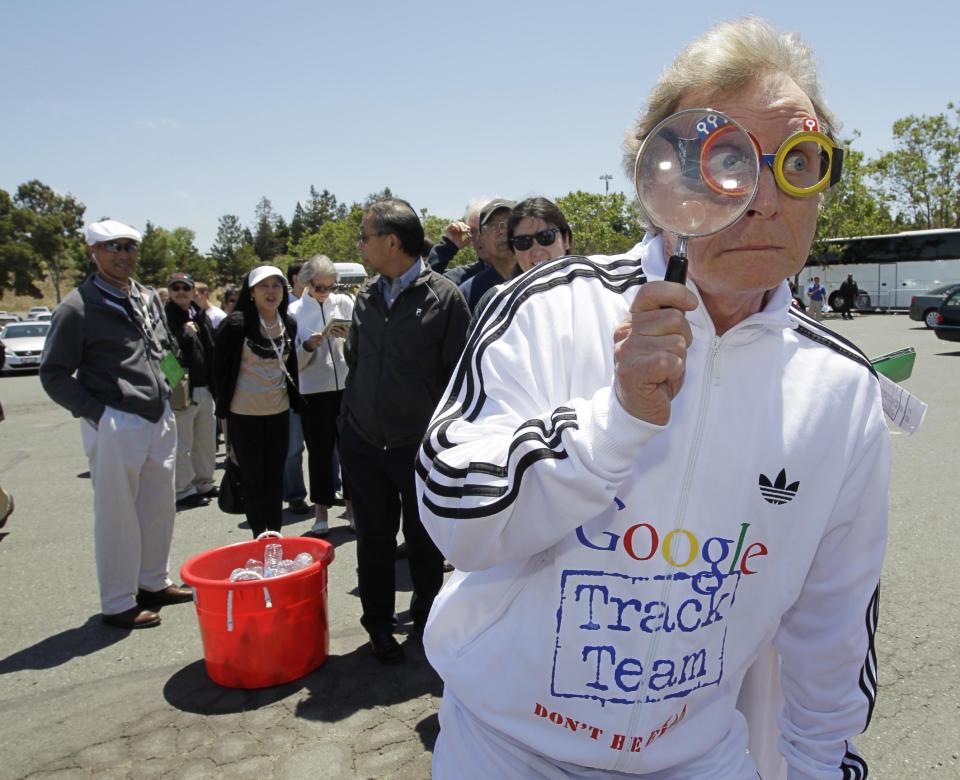 Consumer Watchdog demonstrator Don McLeod protests in front of a Google shareholder outside of Google headquarters in Mountain View, Calif., Thursday, June 21, 2012 before the shareholders meeting. Protestors demonstrated to help raise awareness of Google's online tracking policy. They are calling for legislation for "Do Not Track" mechanism urged by the FTC. They are protesting information from being gathered by Google without permission. (AP Photo/Paul Sakuma)