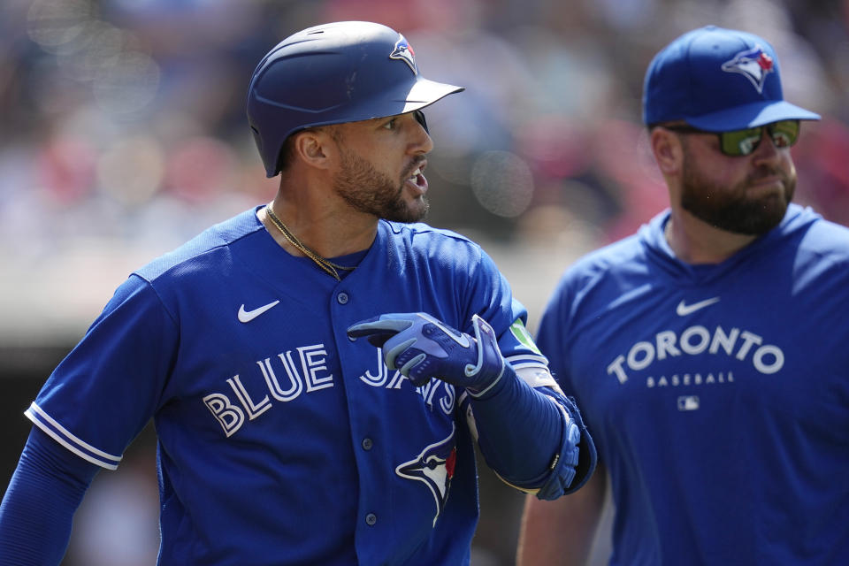 Toronto Blue Jays' George Springer, left, continues to argue after being ejected from the game in the seventh inning of a baseball game against the Cleveland Guardians, Thursday, Aug. 10, 2023, in Cleveland. At right is manager John Schneider, who was also ejected. (AP Photo/Sue Ogrocki)