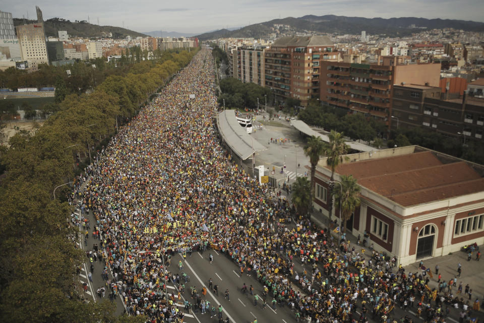 Protesters march into the city on the fifth day of protests over the conviction of a dozen Catalan independence leaders in Barcelona, Spain, Friday, Oct. 18, 2019. Various flights into and out of the region are cancelled Friday due to a general strike called by pro-independence unions and five marches of tens of thousands from inland towns are expected converge in Barcelona's center on Friday afternoon for a mass protest with students to and workers who are on strike. (AP Photo/Joan Mateu)