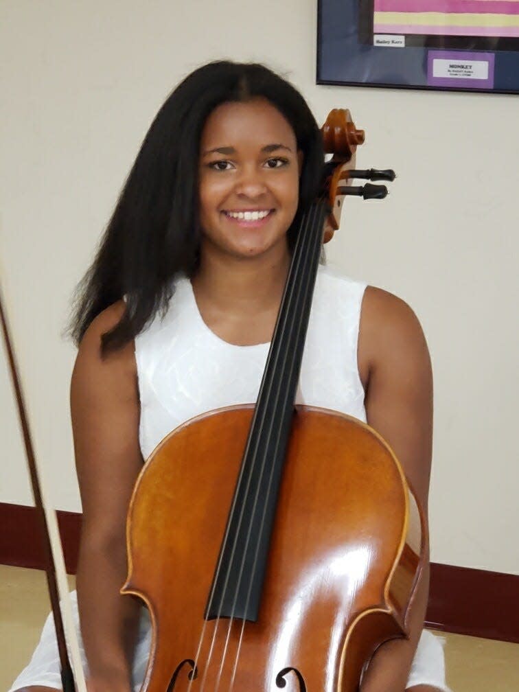 Arlington High School junior is a cellist in the school's advanced orchestra. She also is a standout on the girls basketball team.