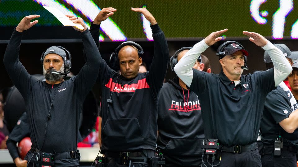 Durde (middle) got his first full-time coaching job on the Atlanta Falcons under then-head coach Dan Quinn. - Carmen Mandato/Getty Images
