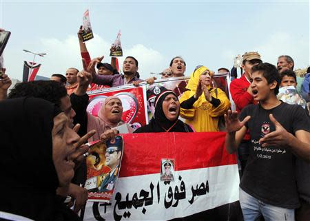 Supporters of Egypt's army chief General Abdel Fattah al-Sisi chant during a rally at Tahrir square in downtown Cairo, November 19, 2013, to commemorate the second anniversary of the deaths of 42 people in clashes with security forces on Mohamed Mahmoud Street nearby. REUTERS/Mohamed Abd El Ghany