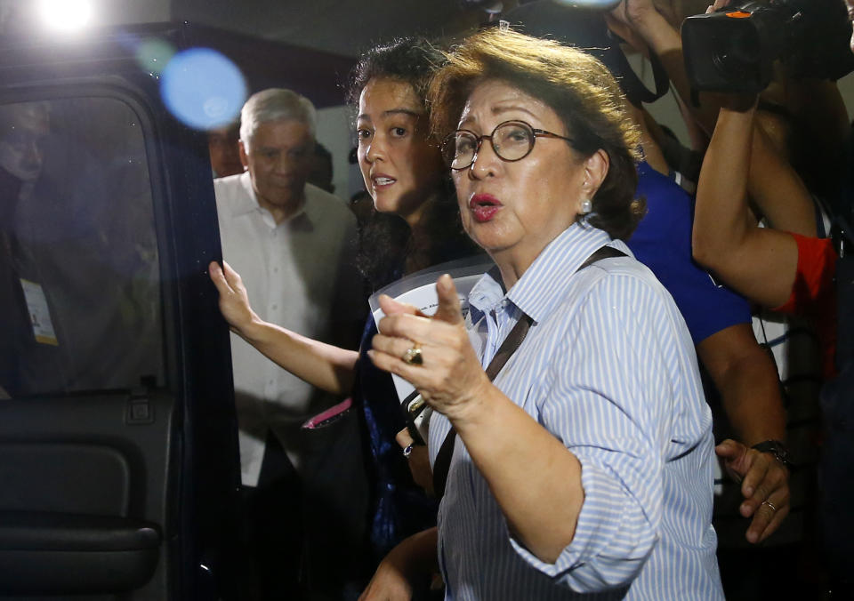 Former Philippine Supreme Court justice Conchita Carpio-Morales gestures as she prepares to board her vehicle upon arrival at the Ninoy Aquino International Airport from Hongkong where she was stopped by Immigration authorities and was held in a room at Hong Kong's airport and ordered to take a flight back to Manila Tuesday, May 21, 2019 in suburban Pasay city south of Manila, Philippines. Carpio-Morales, along with former Foreign Affairs Secretary Albert Del Rosario, once accused Chinese President Xi Jinping of crimes against humanity before the International Criminal Court. (AP Photo/Bullit Marquez)