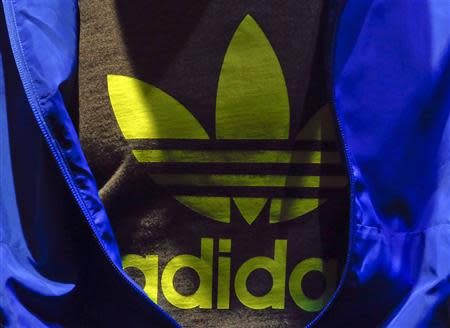 The Adidas logo is pictured on a shirt during the company's annual news conference in Herzogenaurach in this March 7, 2013 file picture. REUTERS/Michael Dalder/Files