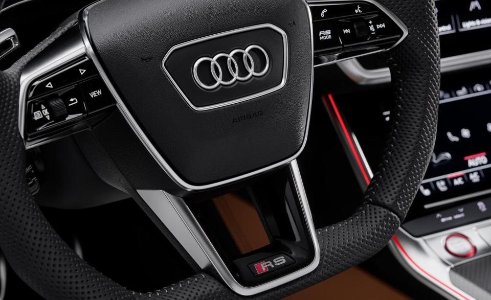 <p>The RS button on the steering wheel controls a customizable driving mode. Comfort, Auto, Dynamic, and Efficiency driving modes are also selectable.</p>