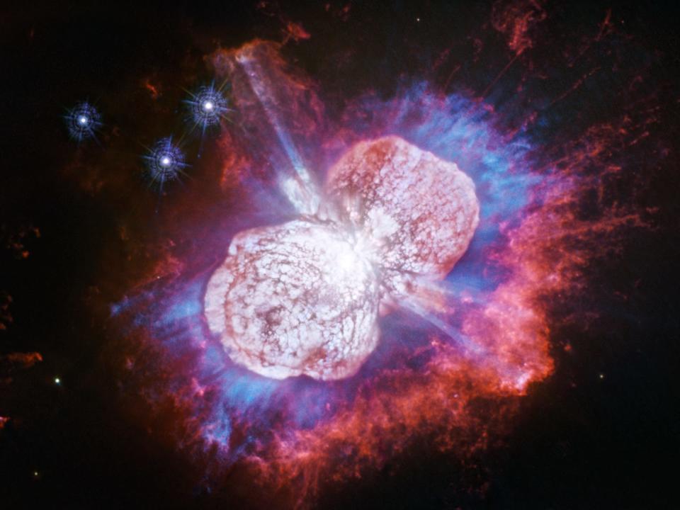 star eta carinae two lobes of pink purple gas in space