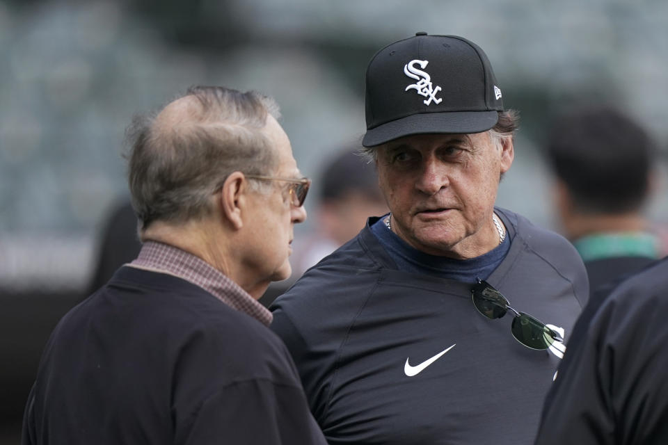 Chicago White Sox owner Jerry Reinsdorf, left, talks with Chicago White Sox manager Tony La Russa before Game 3 of a baseball American League Division Series against the Houston Astros, Sunday, Oct. 10, 2021, in Chicago. (AP Photo/Nam Y. Huh)