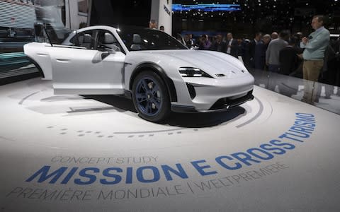 A Porsche AG Mission E hybrid automobile stands on display on day two of the 88th Geneva International Motor Show in Geneva, Switzerland - Credit: Chris Ratcliffe/Bloomberg