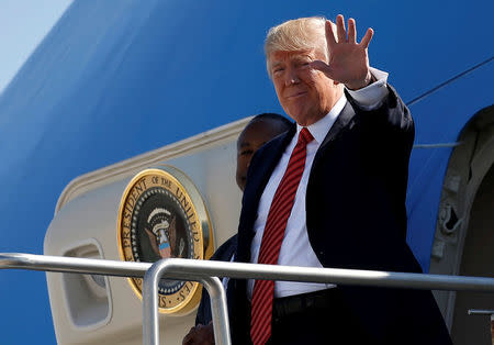 U.S. President Donald Trump waves as he steps out from Air Force One in Reno, Nevada, U.S., August 23, 2017. REUTERS/Joshua Roberts