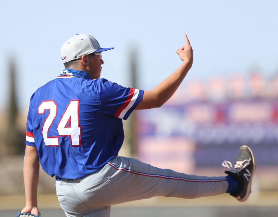 Armani Raygoza, first baseman for Americas High School, signals out to the outfield after a good play in the infield against Eastlake High School on March 23, 2021.