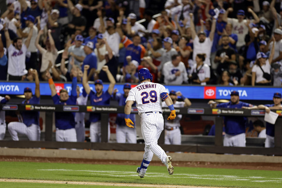 New York Mets' DJ Stewart looks toward the dugout after hitting a two-run home run against the Texas Rangers during the eighth inning of a baseball game Wednesday, Aug. 30, 2023, in New York. (AP Photo/Adam Hunger)