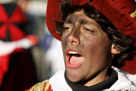 "Zwarte Piet" (Black Pete), who is a Saint Nicholas' assistant is seen during a traditional parade in Amsterdam, Netherlands, November 18, 2018. REUTERS/Eva Plevier