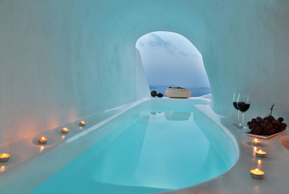 <p>However, there’s no doubt the home’s most eye-catching feature is it’s indoor-outdoor jacuzzi, which offers a spectacular view of the region’s caldera and the crystal-clear waters that surround it. (Airbnb) </p>