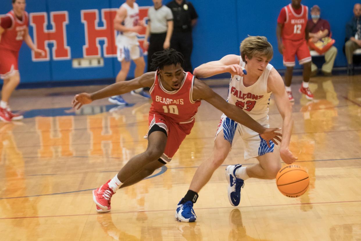 Dwight Canady (10) works to get a steal for the Bearcats Tuesday night against West Henderson. [PAT SHRADER/ SPECIAL TO THE TIMES-NEWS]