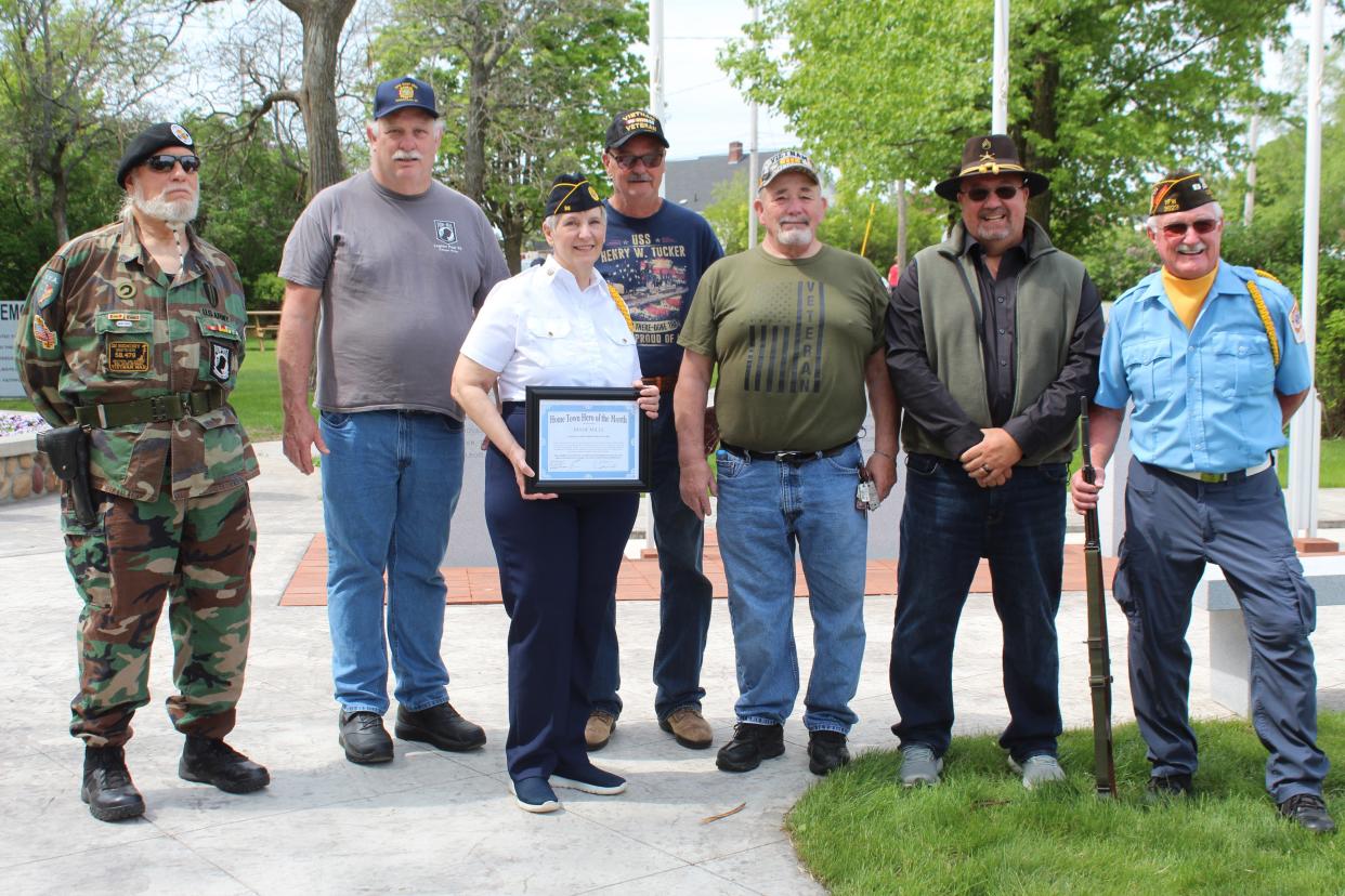 Retired United States Air Force Lt. Colonel Diane Mills (front) was recently awarded the Hometown Hero of the Month award by the Cheboygan County Veterans Subcommittee members during the county's Memorial Day ceremonies.