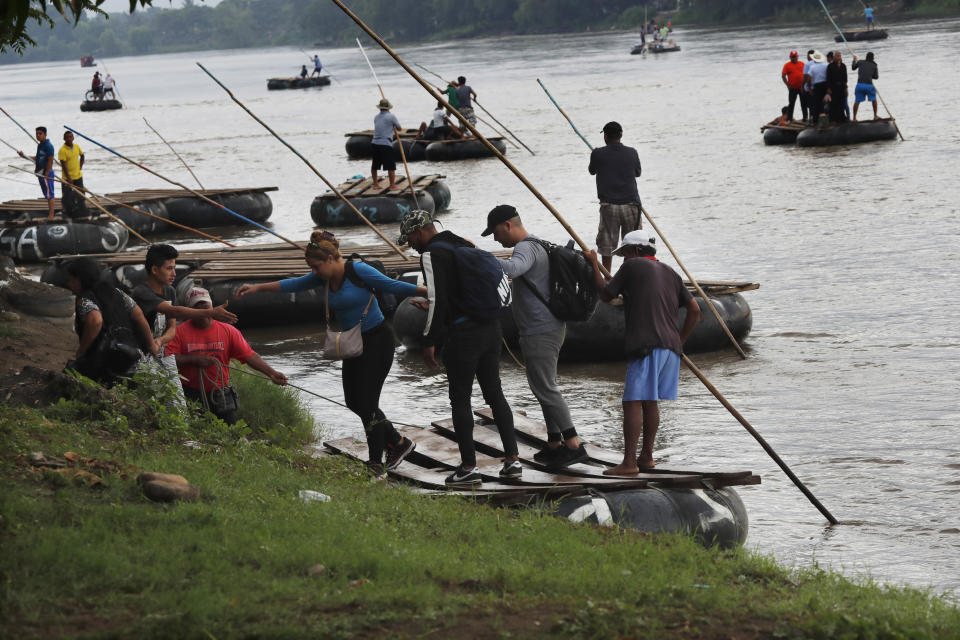 Cuban migrants land on the Mexican side of the Suchiate River on the border with Guatemala, after crossing on a raft near Ciudad Hidalgo, Mexico, early Tuesday, June 11, 2019. Mexican officials say they are beginning deployment of 6,000 National Guard troops for immigration enforcement, an accelerated commitment made as part of an agreement with the United States last week to head off threatened U.S. tariffs on imports from Mexico. (AP Photo/Marco Ugarte)