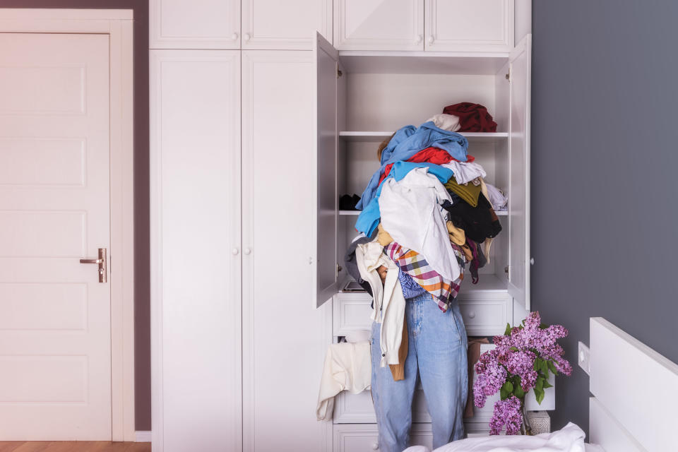 A woman cleaning up her wardrobe