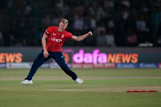 Luke Wood celebrates the wicket of Mohammad Nawaz