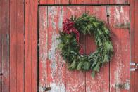 <p>Wreaths have been used by different cultures for various reasons over the centuries: the Greeks handed out wreaths like trophies to athletes and the Romans wore them as crowns. Christmas wreaths were originally believed to be a bi-product of the <a href="https://www.countryliving.com/home-design/decorating-ideas/g24561200/rustic-christmas-trees/" rel="nofollow noopener" target="_blank" data-ylk="slk:Christmas tree;elm:context_link;itc:0;sec:content-canvas" class="link ">Christmas tree</a> tradition begun by northern Europeans in the 16th century. As the evergreens were <a href="https://time.com/5482144/christmas-wreath-origins/" rel="nofollow noopener" target="_blank" data-ylk="slk:trimmed into triangles;elm:context_link;itc:0;sec:content-canvas" class="link ">trimmed into triangles</a> (the three points meant to represent the holy trinity), the discarded branches would be shaped into a ring and hung back on the tree as decoration. The circular shape, one without an end, also came to symbolize eternity and the Christian concept of everlasting life. </p>
