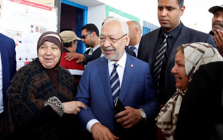 Rached Ghannouchi, the head of the Ennahda party, poses after casting his vote at a polling station for the municipal election in Tunis, Tunisia, May 6, 2018. REUTERS/Zoubeir Souissi