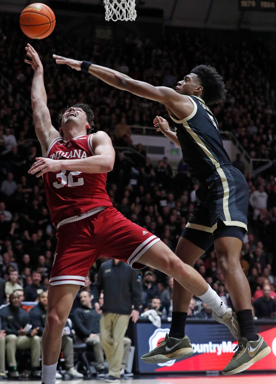 Indiana Hoosiers guard Trey Galloway (32) shoots the ball over Purdue Boilermakers guard Myles Colvin (5) during the NCAA men’s basketball game, Saturday, Feb. 10, 2024, at Mackey Arena in West Lafayette, Ind.