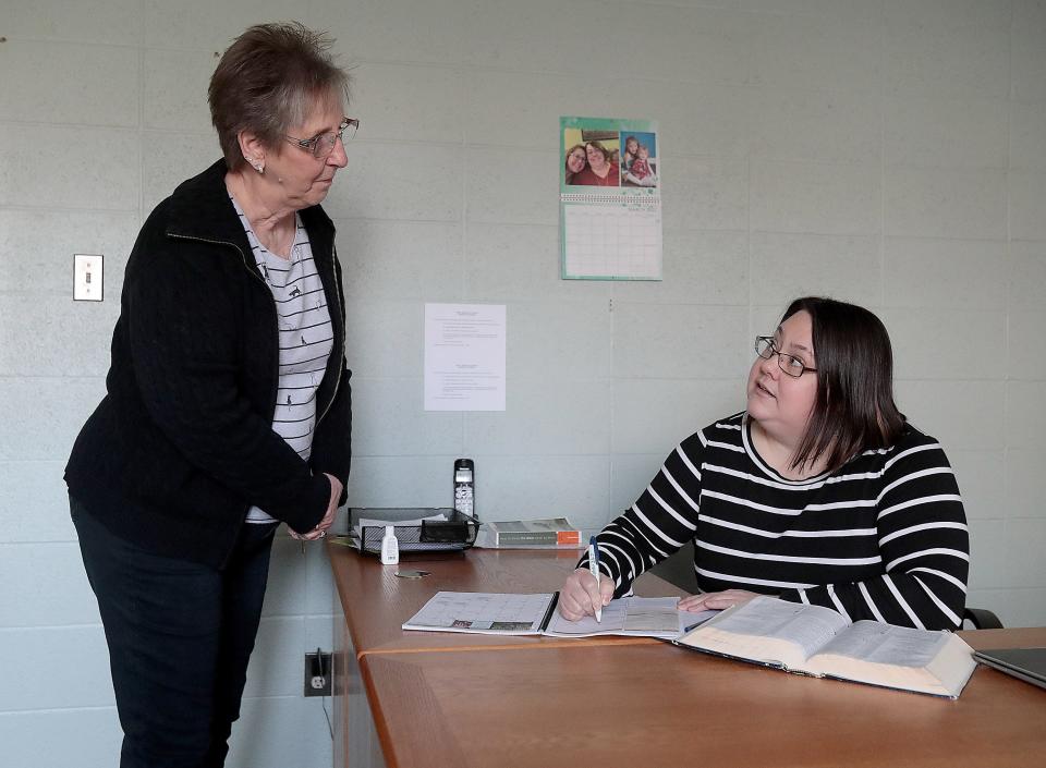 Sara Koons, First Christian Church's new pastor, right, and office manager Criss Davis work on planning for the church. The church has been without a pastor since 2020 when former Pastor Steven Gower left in early 2020. With the pandemic, it took nearly two years to find a replacement.