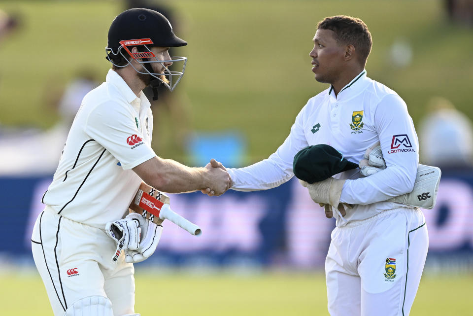 Kane Williamson, left, of New Zealand is congratulated by South African wicket keeper Clyde Fortuin after Williamson scored a century the first day of the first cricket test between New Zealand and South Africa at Bay Oval, Mt Maunganui, New Zealand. Sunday Feb. 4, 2024. (Photo: Andrew Cornaga/Photosport via AP)