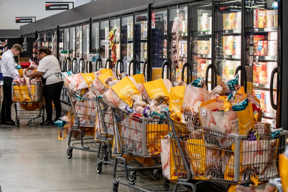 Karen Jones prepares the giveaway bags, prepared for the first 200 customers to come to the new Richboro Giant during Friday’s opening. The store, located at 1025 2nd St. Pike, offers more spacious aisles and new features, including a new Beer and Wine section, a specialty cheese section and an artisan bread case with self-serve loaf slicing.