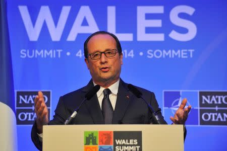 French President Francois Hollande speaks during a news conference on the second and final day of the NATO summit at the Celtic Manor resort, near Newport, in Wales September 5, 2014. REUTERS/Rebecca Naden