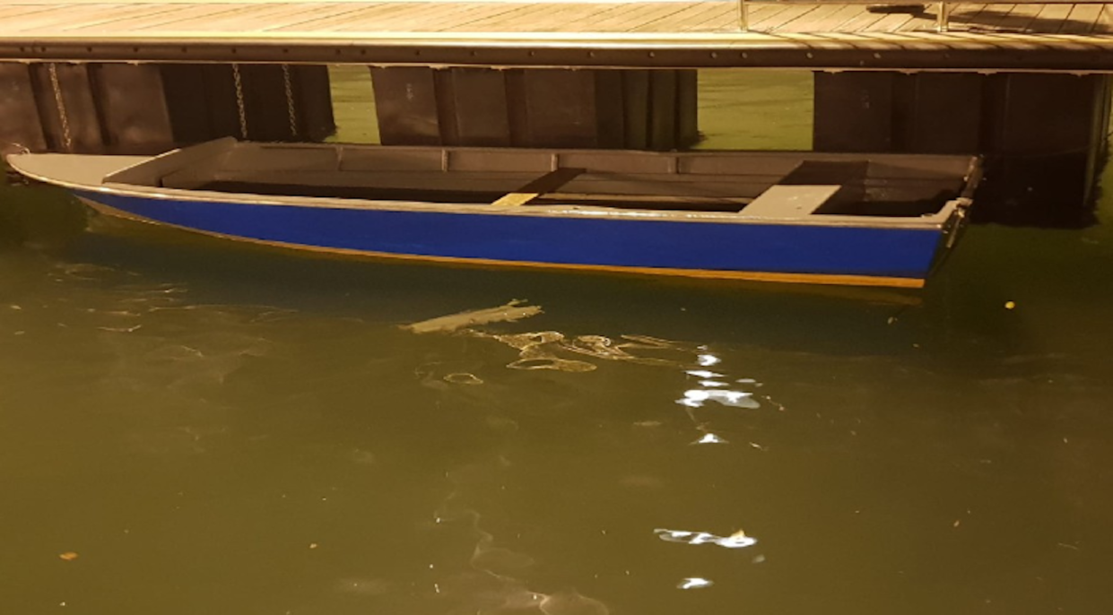 The motorised fibreglass boat in which two man allegedly tried to enter illegally into Singapore (PHOTO: Singapore Police Force)