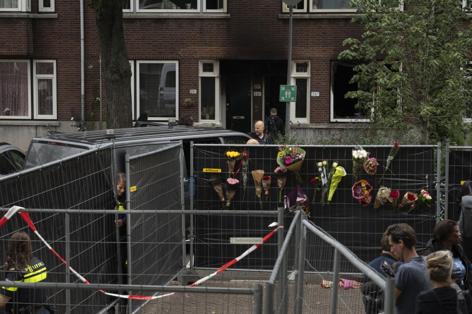 Police officers are seen at the scene of a shooting in Rotterdam, Netherlands, Friday, Sept. 29, 2023. Police in the Netherlands said a lone gunman wearing a bulletproof vest opened fire in an apartment and a hospital in the Dutch port city of Rotterdam, Thursday, Sept. 28, 2023, killing three people, including a 14-year-old girl. (AP Photo/Peter Dejong)