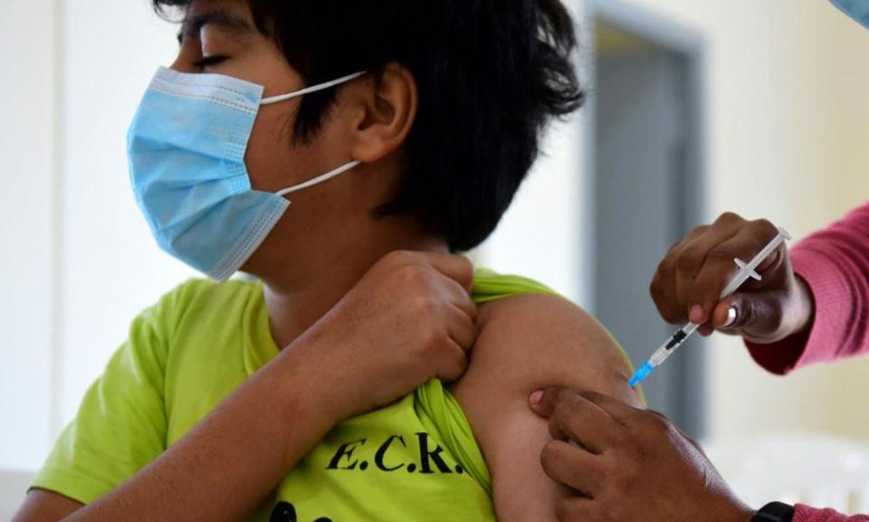 A minor receiving a Covid-19 vaccine in Asuncion, Paraguay. Pfizer and BioNTech have said trial results showed their coronavirus vaccine was safe and produced a robust immune response in children aged five to 11.