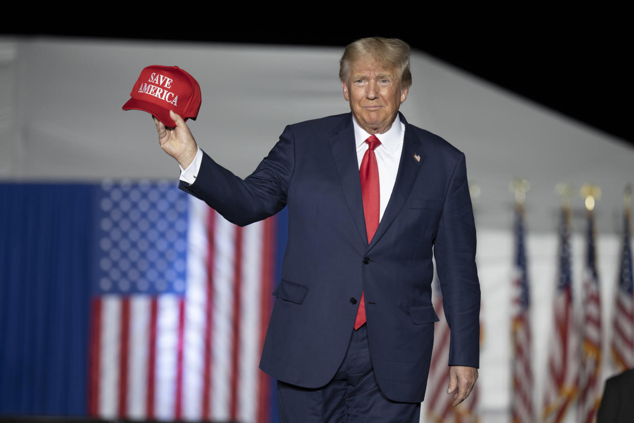 Former President Donald Trump makes his entrance at a rally at the Minden Tahoe Airport in Minden, Nev.,  Oct. 8, 2022. (AP Photo/José Luis Villegas)