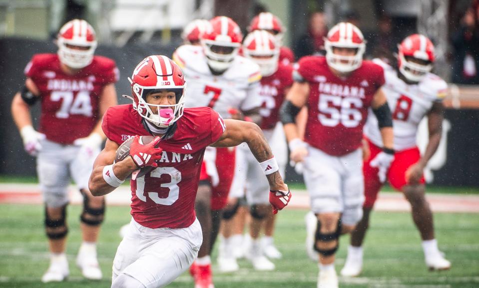 Indiana's Elijah Sarratt (13) runs after the catch during the Indiana versus Maryland football game at Memorial Stadium on Saturday, Sept. 28, 2024.