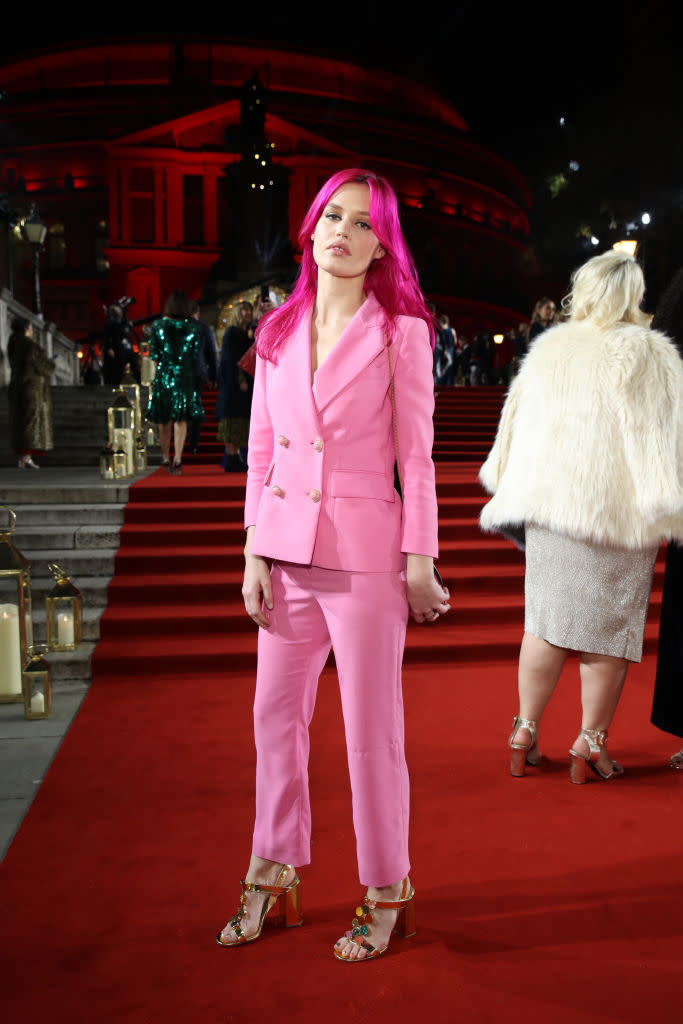 <p>Georgia May Jagger debuted hot pink hair at the fashion event to accessorise her candy floss-hued suit. <em>[Photo: Getty]</em> </p>