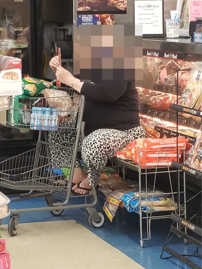 A woman sitting on loaves of bread